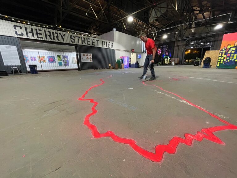 JJ prepping a spray-chalk installation of the perimeter at Cherry Street Pier for the walk closing party